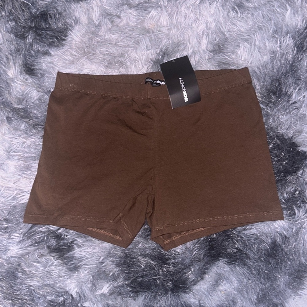 Fashion nova shorts never worn . Stretchy , feels comfortable soft material